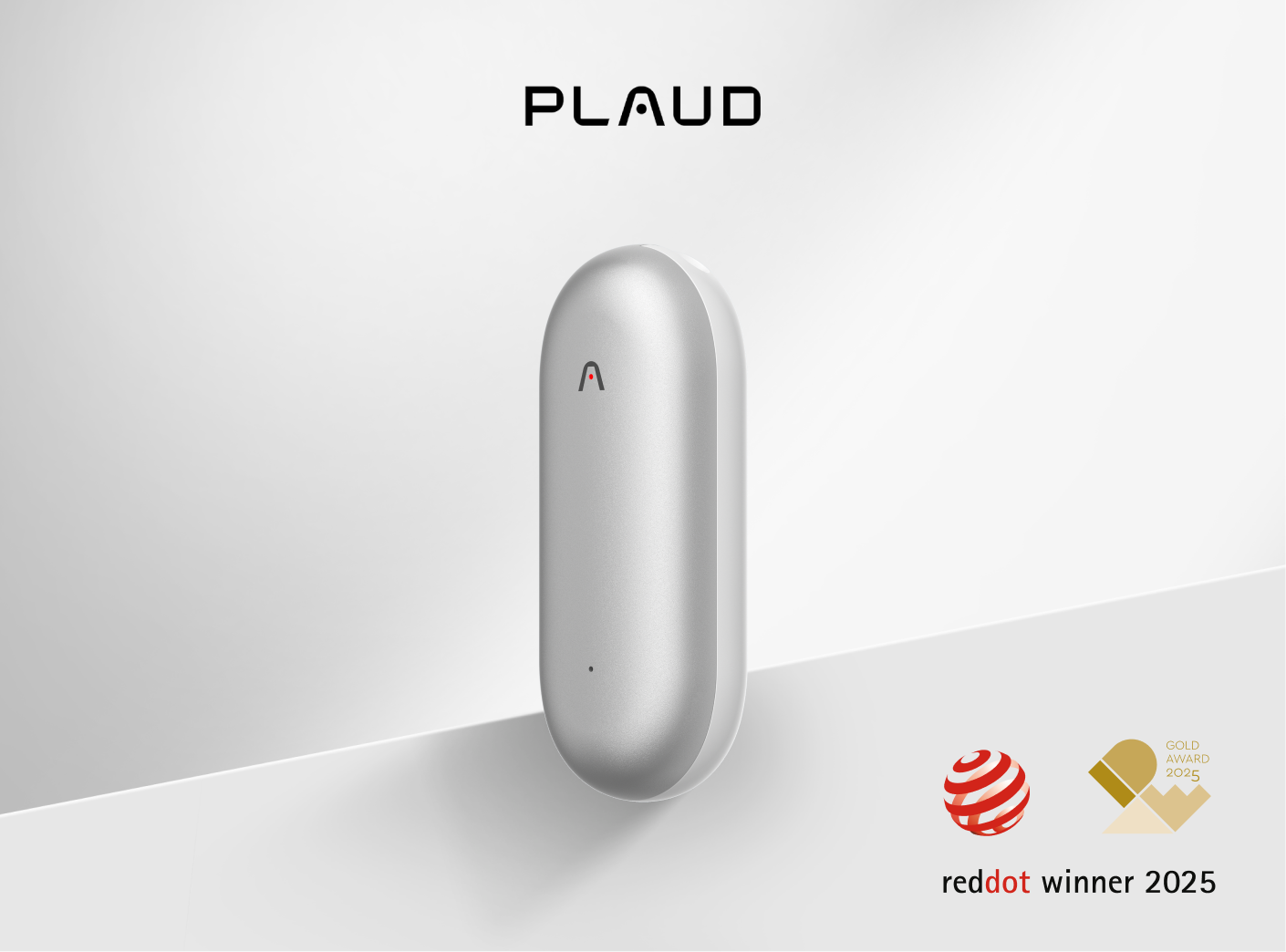 Silver Plaud NotePin AI voice recorder, capsule-shaped, with a red 'A' icon, shown with Red Dot and Gold awards.